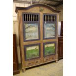 A 19th century Continental painted armoire, later decorated with birds on branches, rabbits and