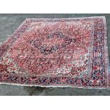 A large Persian red ground carpet, 444 x 347cmCONDITION: Looks to be in good condition, probably