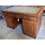 An early 20th century oak pedestal desk, width 136cmCONDITION: Top a little faded with a central