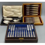 A Victorian rosewood cased set of eighteen plated dessert knives and forks, and two other cased sets