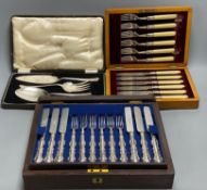 A Victorian rosewood cased set of eighteen plated dessert knives and forks, and two other cased sets