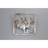 A Georg Jensen sterling 'Cockerel and foliate spray' square brooch, designed by Arno Malinowski, no.