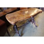 A Victorian figured walnut centre table, with serpentine top, 122 x 61cmCONDITION: A little faded