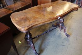 A Victorian figured walnut centre table, with serpentine top, 122 x 61cmCONDITION: A little faded