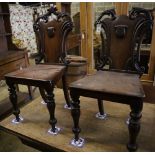 A pair of Victorian mahogany hall chairs (one a.f.)CONDITION: Fair wear and tear, one chairs has the