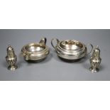 A George V silver sugar bowl and cream jug, London 1935 and a pair of Edwardian silver salt and
