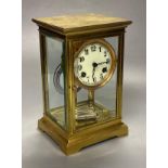 A lacquered brass four-glass mantel clock, Waterbury Clock Co., USA, gong striking movement,