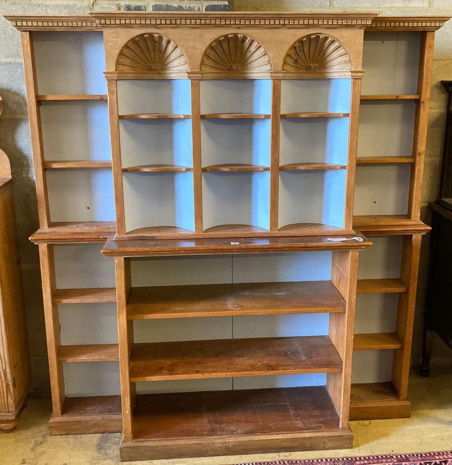 A pine breakfront open bookcase, width 172cm height 176cmCONDITION: Looks to have been made up