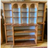 A pine breakfront open bookcase, width 172cm height 176cmCONDITION: Looks to have been made up
