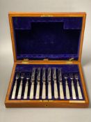 A cased set of plated dessert knives and forks with mother of pearl handlesCONDITION: Case is a