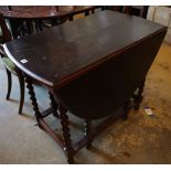 A 1920's oak gateleg table, with spiral twist underframe, width 91cmCONDITION: Top is very dark