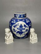 A Chinese blue and white ginger jar and cover, Kangxi period, 22.5cm and two blanc de chine dogs