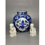 A Chinese blue and white ginger jar and cover, Kangxi period, 22.5cm and two blanc de chine dogs