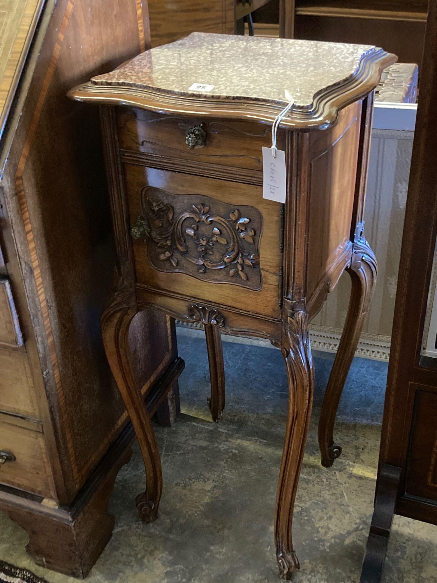 An Edwardian carved walnut bedside cabinet, with marble top and ceramic lined interior, width 41cm