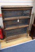 An oak Globe Wernicke three tier bookcase, width 87cmCONDITION: Heavily worn and rubbed from use