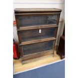 An oak Globe Wernicke three tier bookcase, width 87cmCONDITION: Heavily worn and rubbed from use