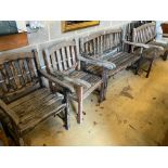 Two stained teak garden benches and matching armchairs, bench widths 126cm and 123cmCONDITION: Bench