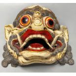 A Balinese carved and painted wood dragon mask, 28cmCONDITION: Generally good.