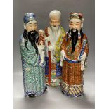 A group of three Chinese porcelain immortals, 47cmCONDITION: Figure wearing orange tunic has been