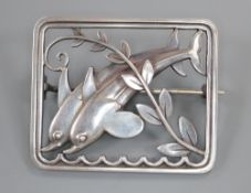 A George Jensen sterling twin dolphin square brooch, designed by Arno Malinowski, no. 255, 37mm.