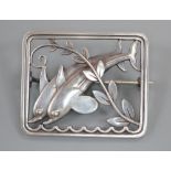 A George Jensen sterling twin dolphin square brooch, designed by Arno Malinowski, no. 255, 37mm.