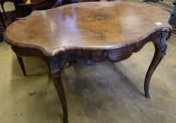 A Victorian figured walnut centre table of serpentine form, with ormolu mounted cabriole legs, width