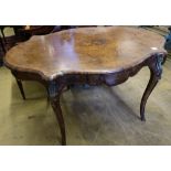 A Victorian figured walnut centre table of serpentine form, with ormolu mounted cabriole legs, width