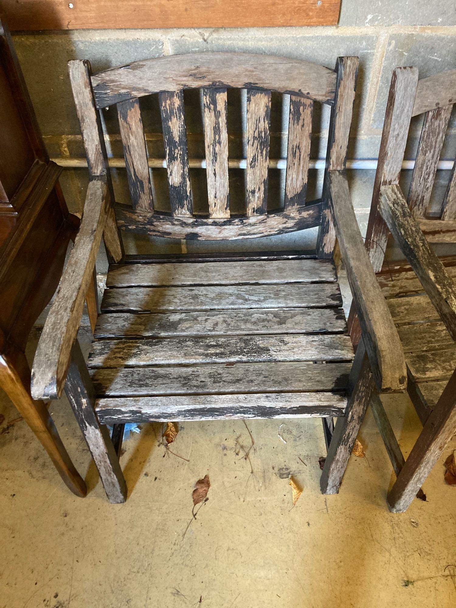 Two stained teak garden benches and matching armchairs, bench widths 126cm and 123cmCONDITION: Bench - Image 2 of 4