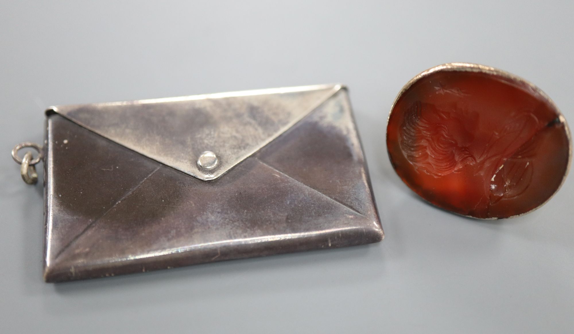 A 19th century yellow metal and carnelian set intaglio fob seal(a.f.) and an Edwardian silver double
