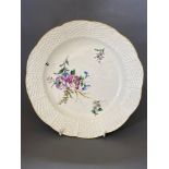 A Chantilly dessert dish, enamel painted with scattered flowers, with wicker border,