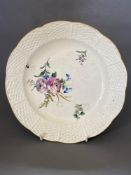 A Chantilly dessert dish, enamel painted with scattered flowers, with wicker border,