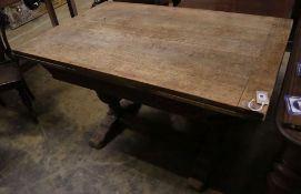 An Elizabethan style oak draw leaf extending dining table, 210cm extended width 80cm height