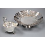 A George V silver sauceboat, Sheffield, 1917, 60z and a plated stand.CONDITION: Both in good