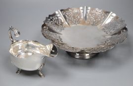 A George V silver sauceboat, Sheffield, 1917, 60z and a plated stand.CONDITION: Both in good