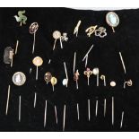 Twenty assorted Victorian and later mainly yellow metal and gem set stick pins, including diamond