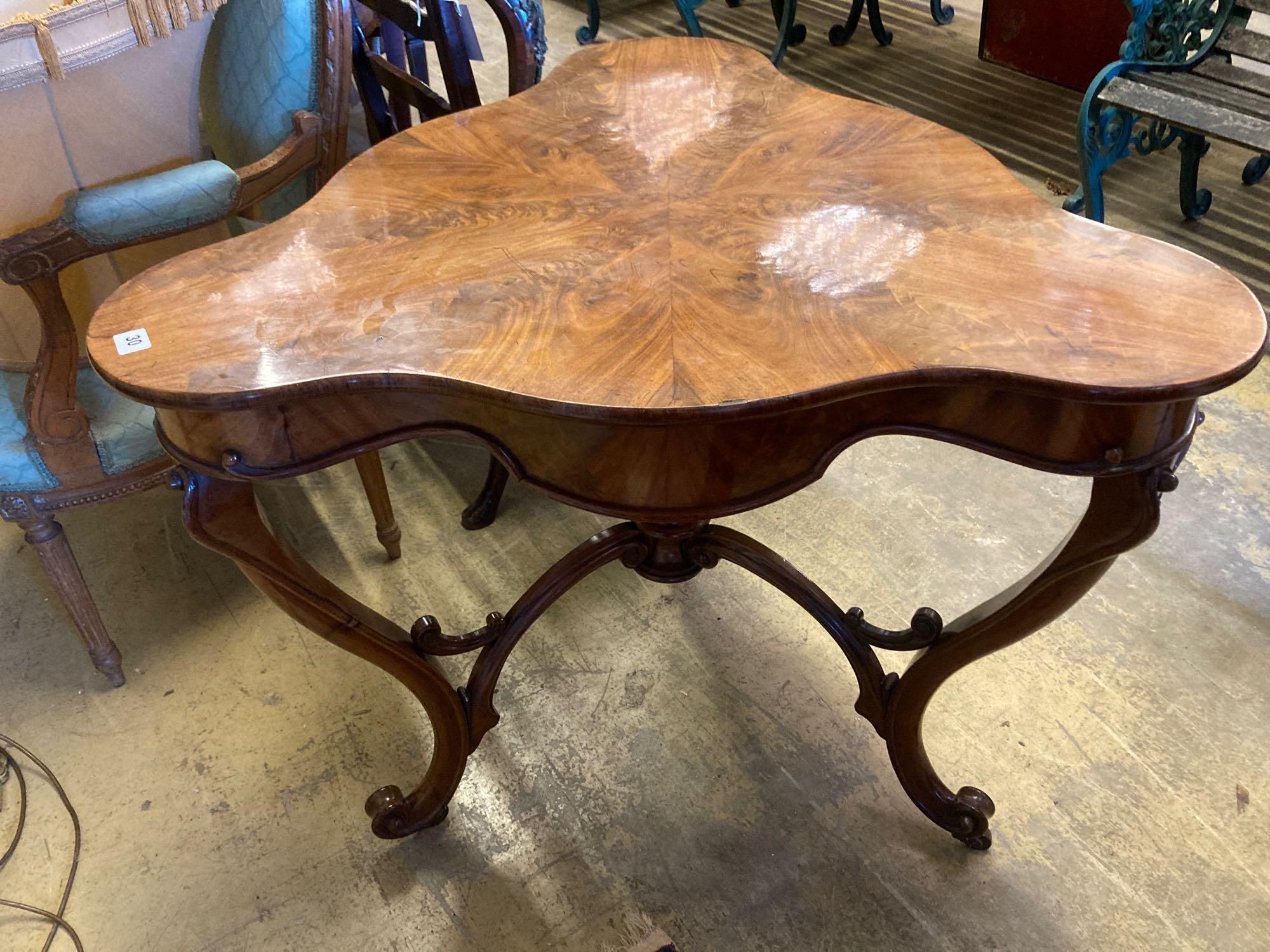 A Continental mahogany trefoil corner table, width 88cmCONDITION: Has bee repolished at some