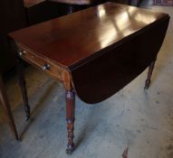 A Regency mahogany sofa table, with D shaped flats and frieze drawer on turned and fluted tapered