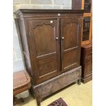 An 18th century oak press cupboard with base drawer, width 120cm height 169cmCONDITION: Overall