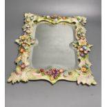 A porcelain floral encrusted wall mirror, German, Von Schierholz, 30 x 40cmCONDITION: Some chips