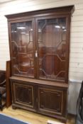 An Edwardian walnut bookcase, width 142cm height 225cmCONDITION: Of dark brown walnut tone but