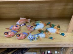 A graduated set of Beswick flying ducks and five Royal Crown Derby animal paperweights and another