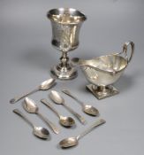 A George V silver sauceboat, a French white metal goblet(repaired) and seven assorted 19th century