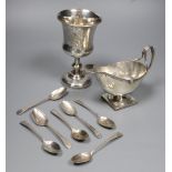 A George V silver sauceboat, a French white metal goblet(repaired) and seven assorted 19th century