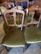 A set of four Victorian inlaid walnut dining chairsCONDITION: All in good condition for age, fair