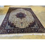 A large Persian cream ground carpet, 280 x 387cmCONDITION: Dirty in places, brown staining in one