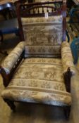 A Victorian aesthetic movement inlaid mahogany armchair, with later elephant pattern upholstery,