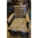 A Victorian aesthetic movement inlaid mahogany armchair, with later elephant pattern upholstery,