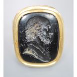 A 9ct and black onyx? intaglio ring, carved with the bust of a gentleman to sinister, size R/S,