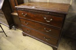 An Edwardian George III style mahogany chest, with brushing slide and three drawers, width