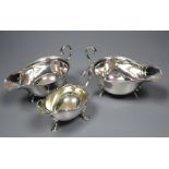 A pair of 1930's silver sauceboats, 5.5 oz and a plated sauceboat.CONDITION: One of the sauceboats